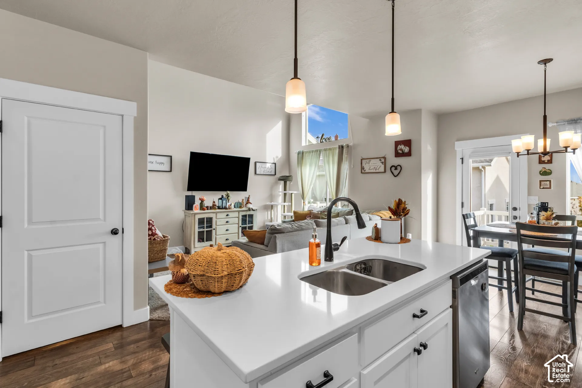 Open-concept kitchen with a dual-basin sink and white countertops