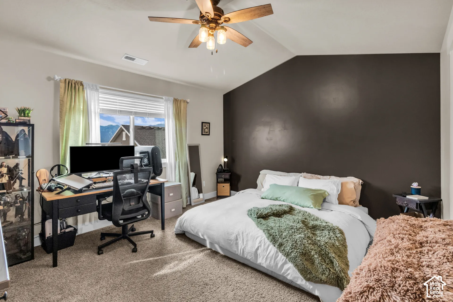 Carpeted flooring, vaulted ceiling, ceiling fan with light fixture, and window with blinds