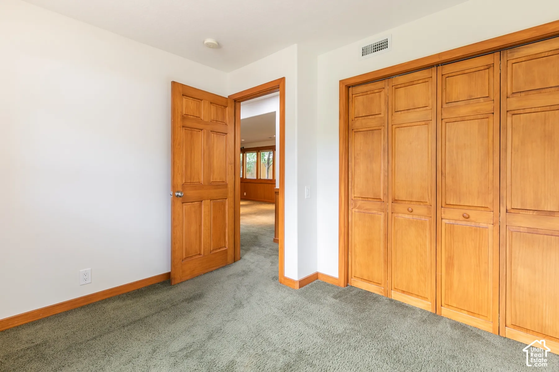 Wood-paneled interior doors, wood-paneled bi-fold closet doors, and wood trim accents