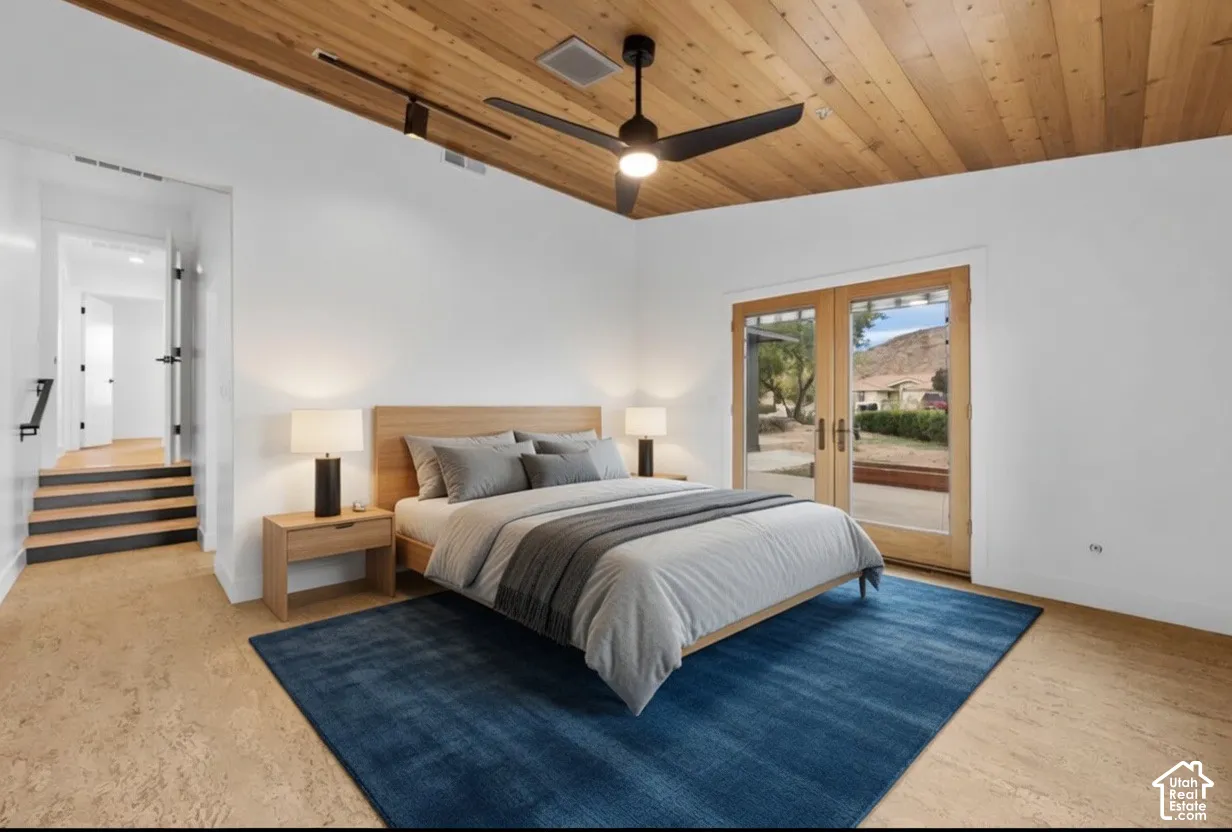 Wood-finish flooring, wood-paneled ceiling, and ceiling fan with integrated lighting