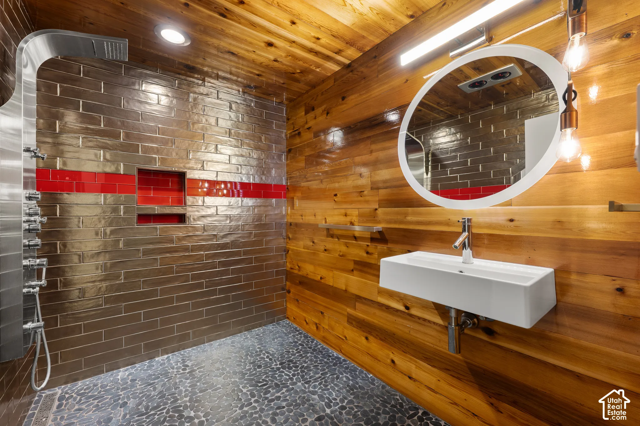 Wood-paneled wall and ceiling with recessed lighting