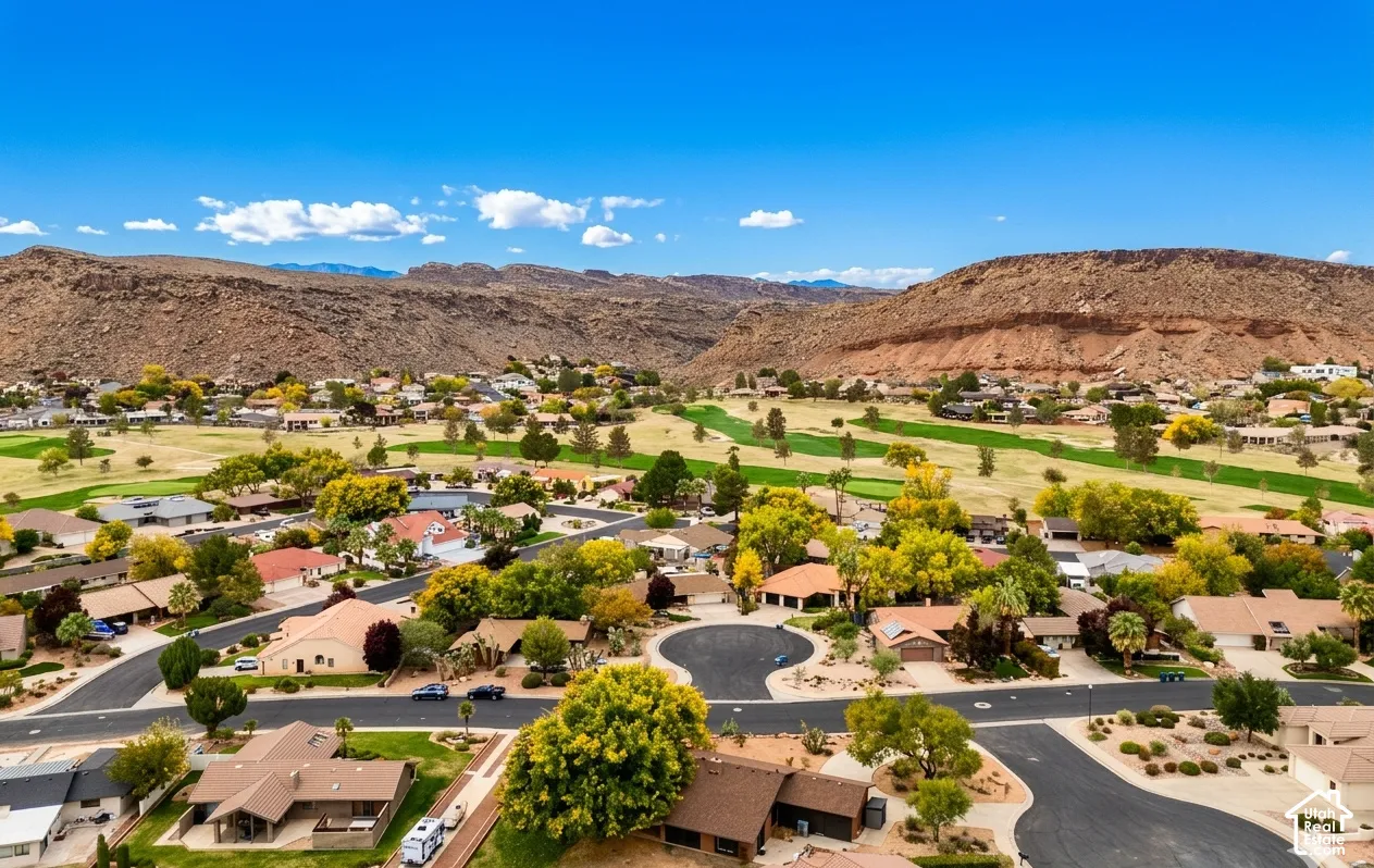 Community featuring residential properties, mature trees, and direct access to a golf course