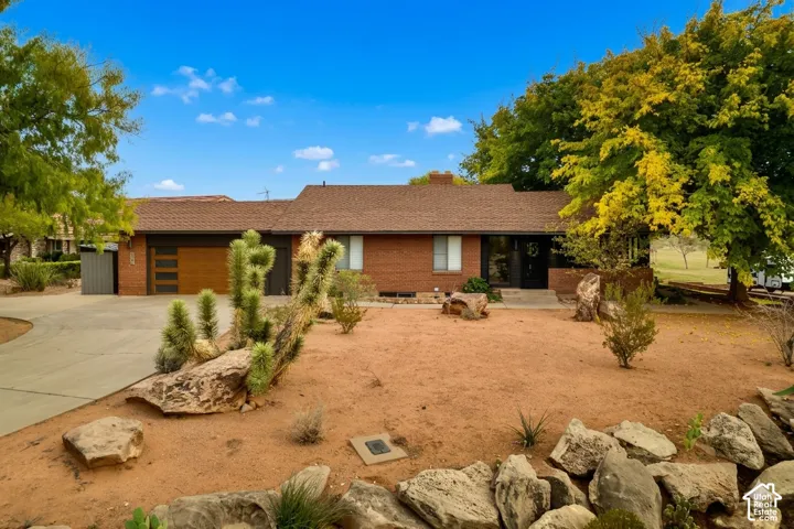 Brick exterior with a brown shingle roof