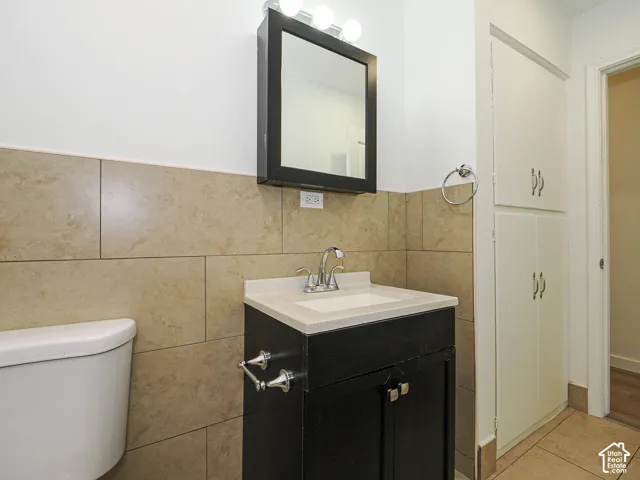 Vanity with an integrated sink, polished chrome faucet, and matte black cabinetry
