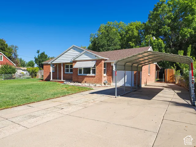 Brick exterior with white gabled siding and a covered front porch