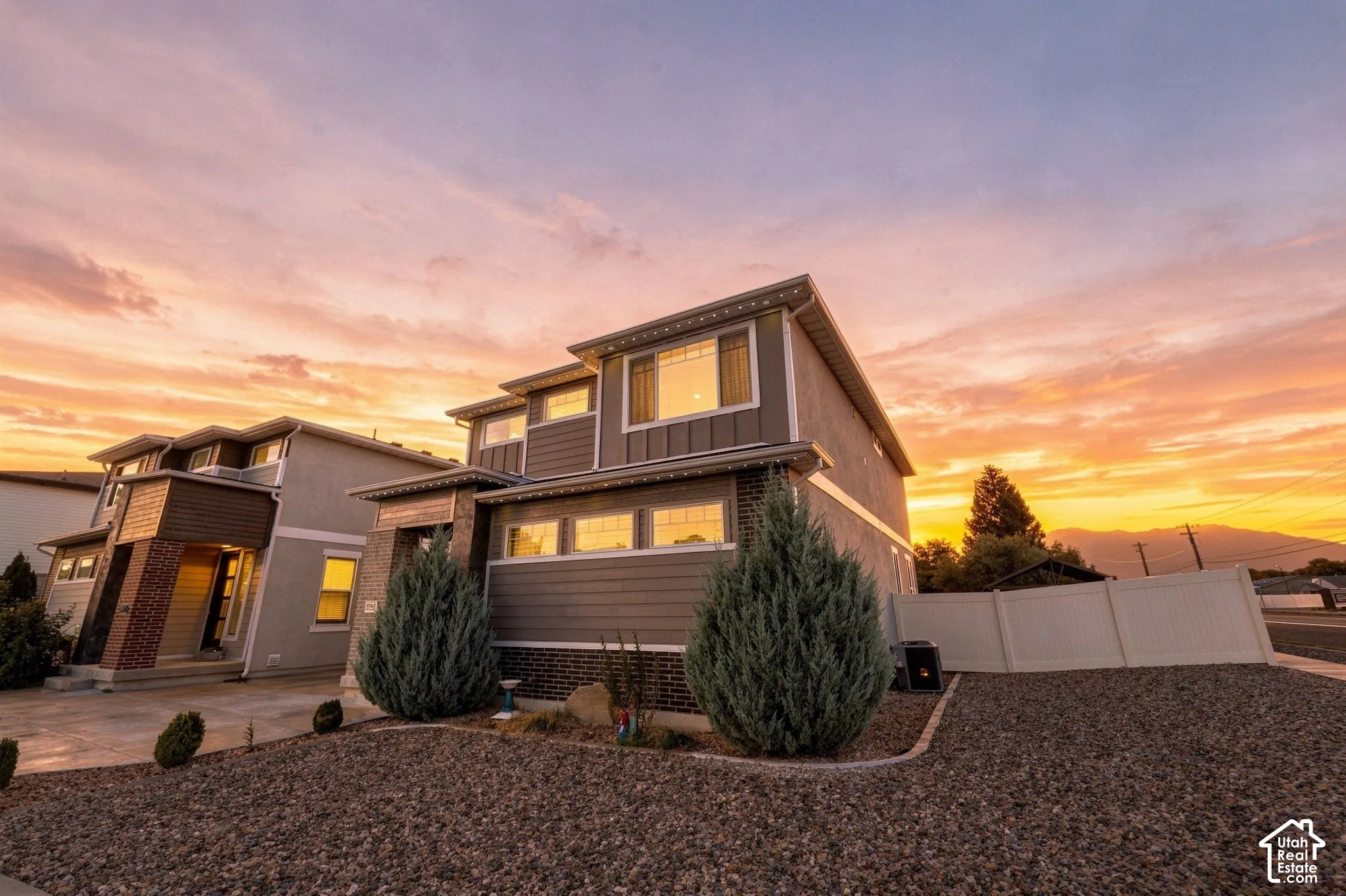 Contemporary exterior with horizontal siding and brick accents