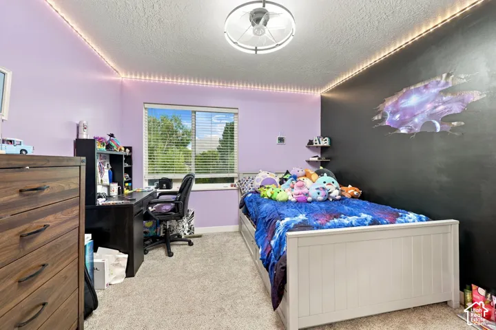 Recessed window with horizontal blinds, light-colored walls, and a ceiling-mounted light fixture