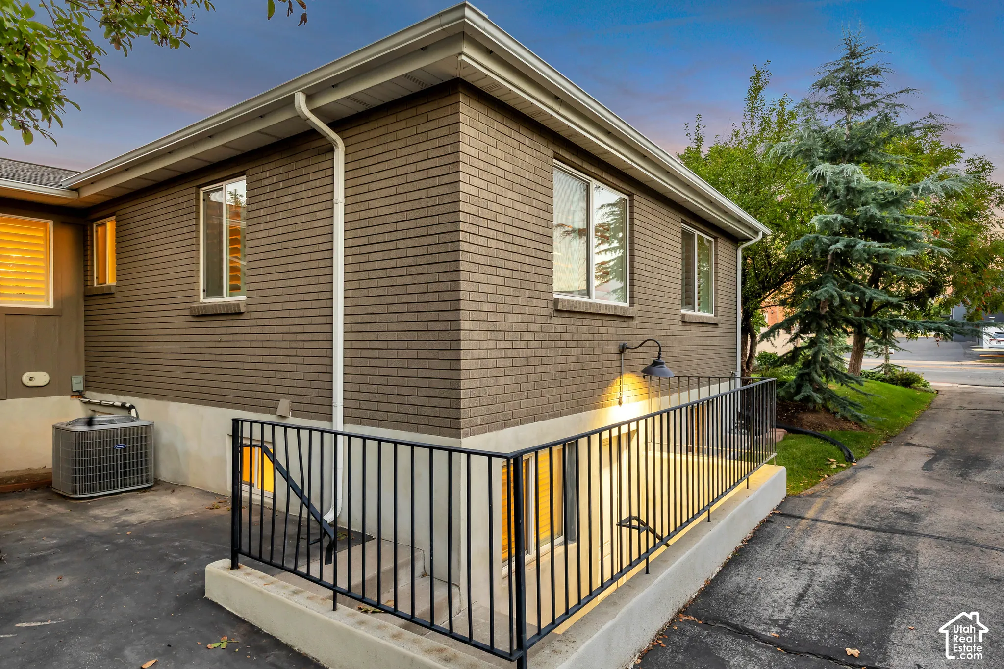 ADU entrance Brick and siding exterior with white window trim