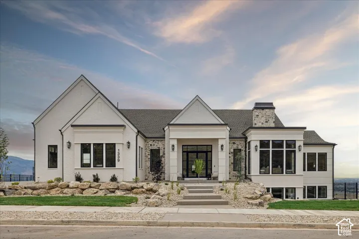 Stately white brick exterior with stone accents
