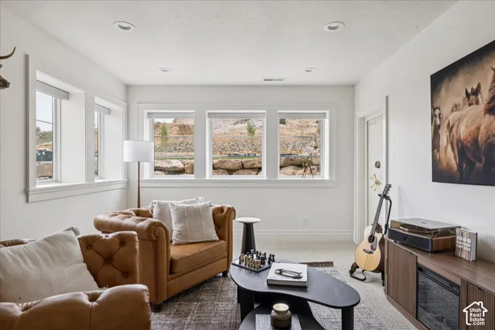 Recessed lighting, multiple windows, white trim, and light-colored wall finishes