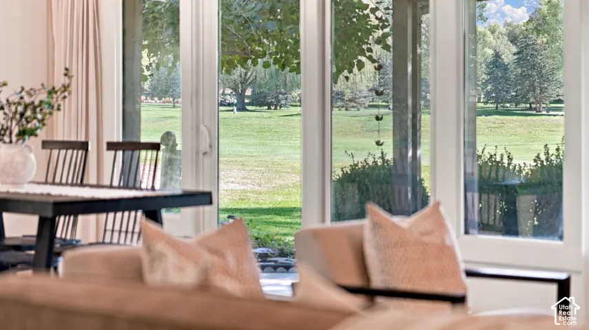 Expansive window wall with white frames, offering abundant natural light