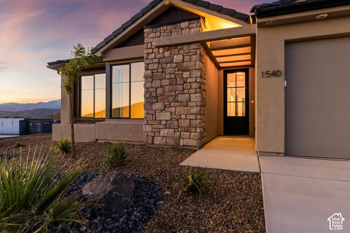 Stone façade accents the stucco exterior