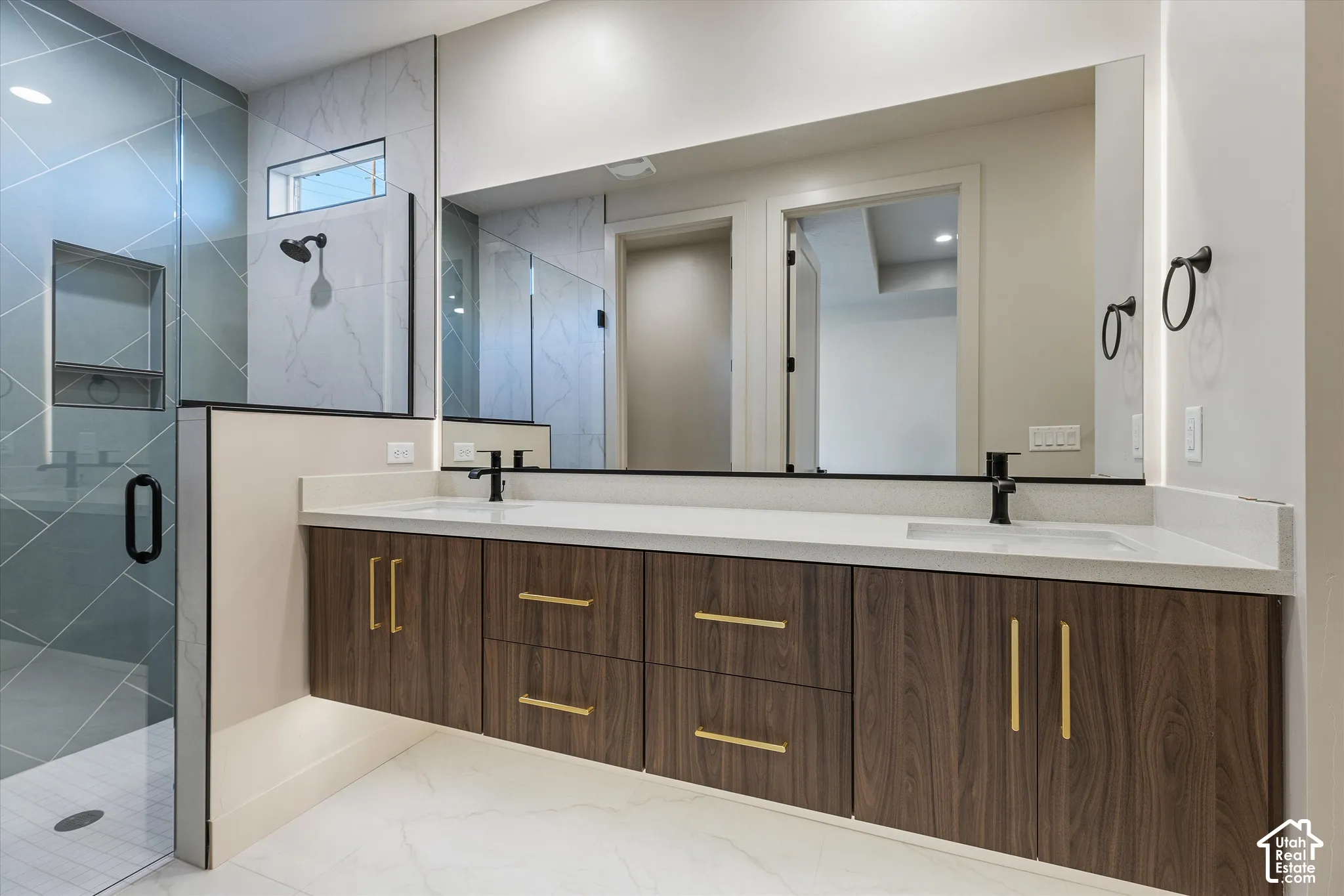 Floating wood-finish double vanity with gold hardware