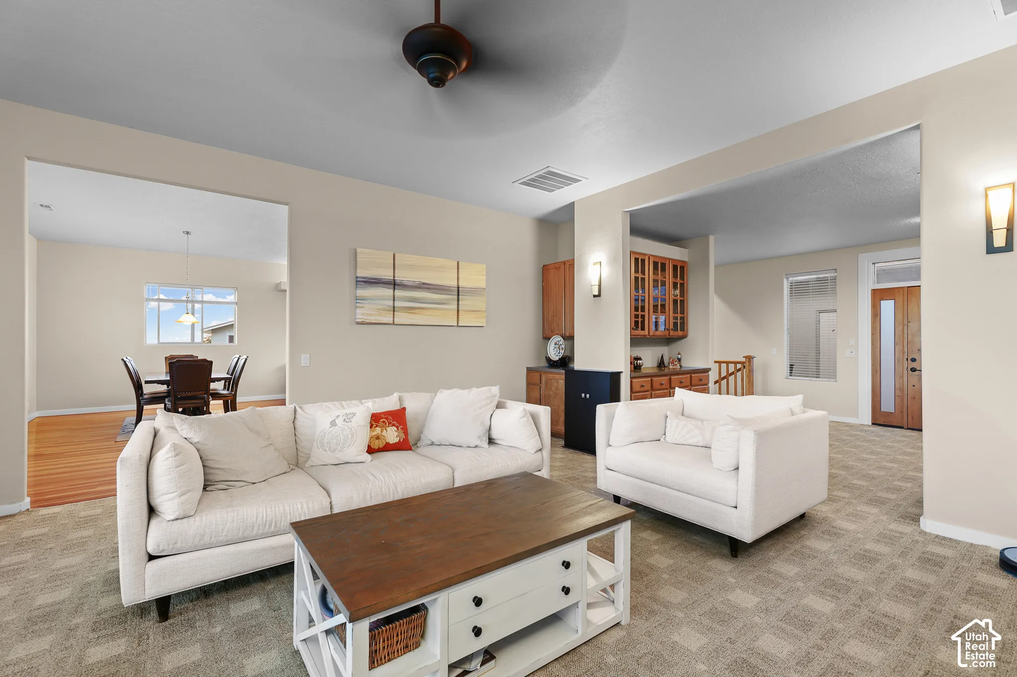 Recessed lighting, wood-finish flooring, built-in cabinetry, and a ceiling fan