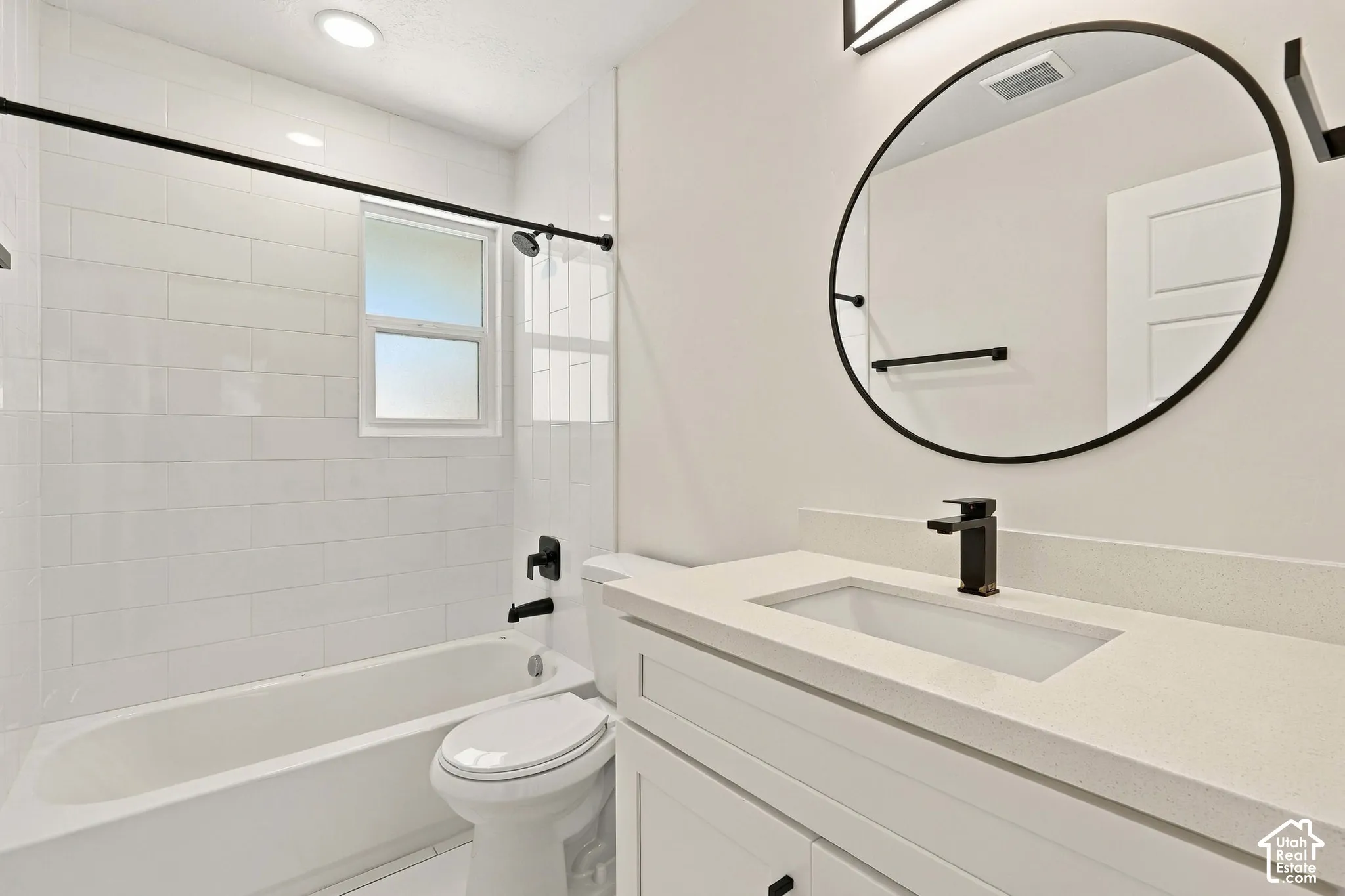 Beautiful & stylish shared bathroom on main floor with black matte accessories