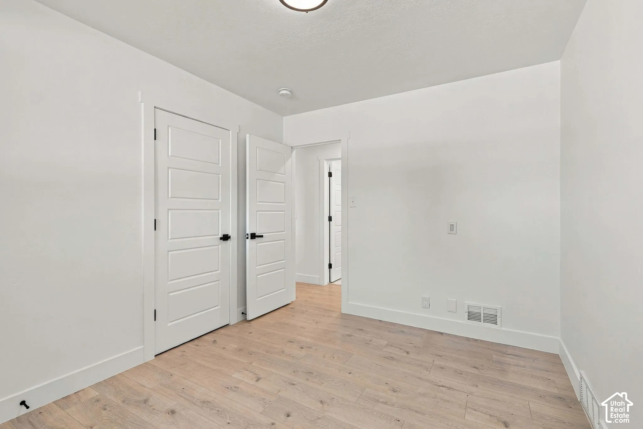 1st bedroom on main floor, across of shared bathroom.