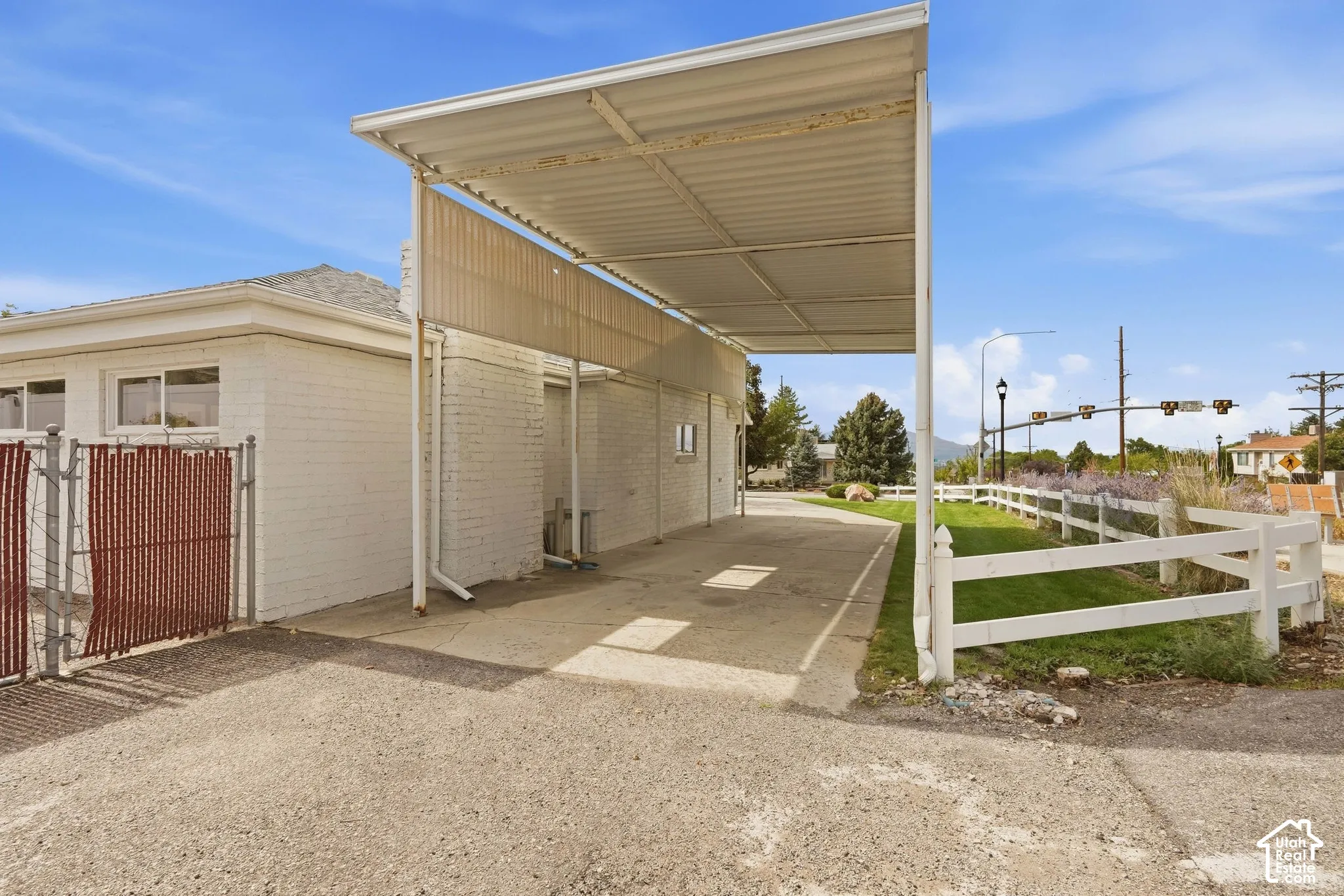Exit (back side of RV-Boat parking). Yes you drive in through the front and out from the side of the property. Easy maneuver!