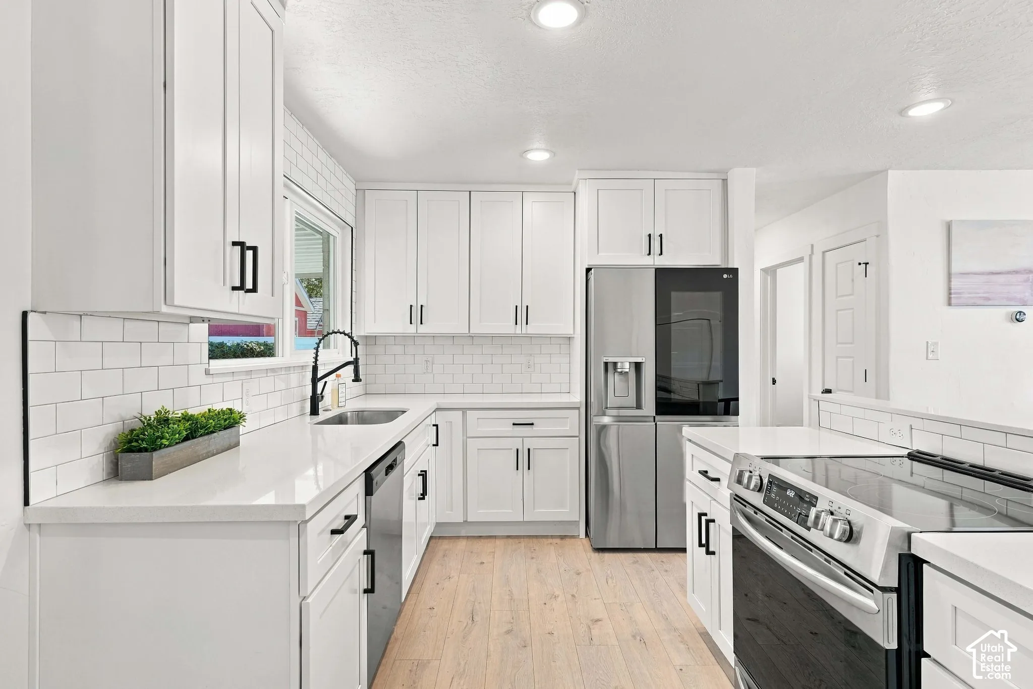 LG refrigerator, beautiful cabinets, & Quartz countertops
