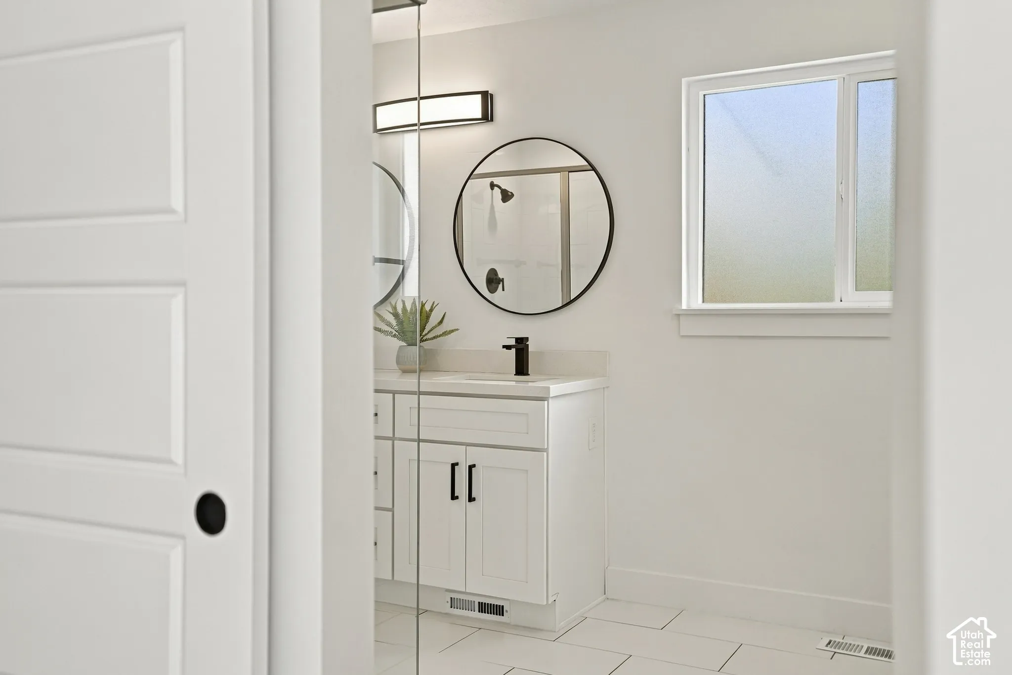 Bathed in natural light, this primary bathroom is spacious. With a WC, huge shower and walk in closet this private bathroom feels more like a spa.