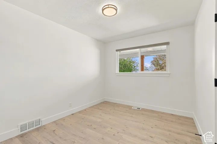1st bedroom on main floor, lots of natural light with good-sized closet.