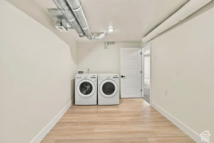 Loads of extra storage in this laundry room.  Washer & Dryer are remaining with the purchase of this home.