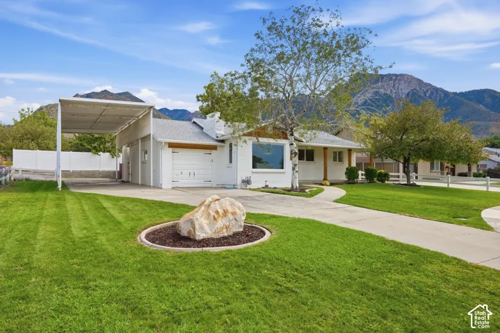 With the Wasatch mountains in your backyard this home is on .20 acres