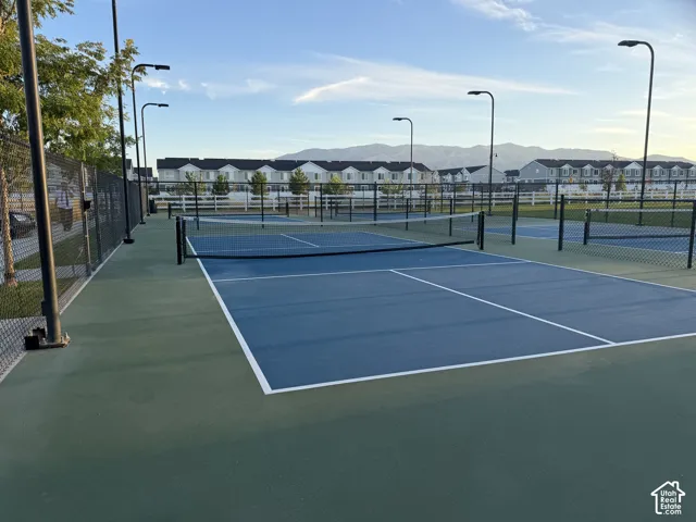 Multiple outdoor courts featuring blue and green surfacing