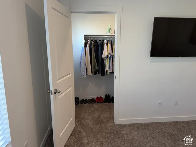 Recessed closet with built-in shelving and hanging rod