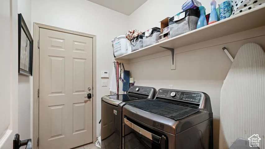 Laundry area featuring built-in shelving