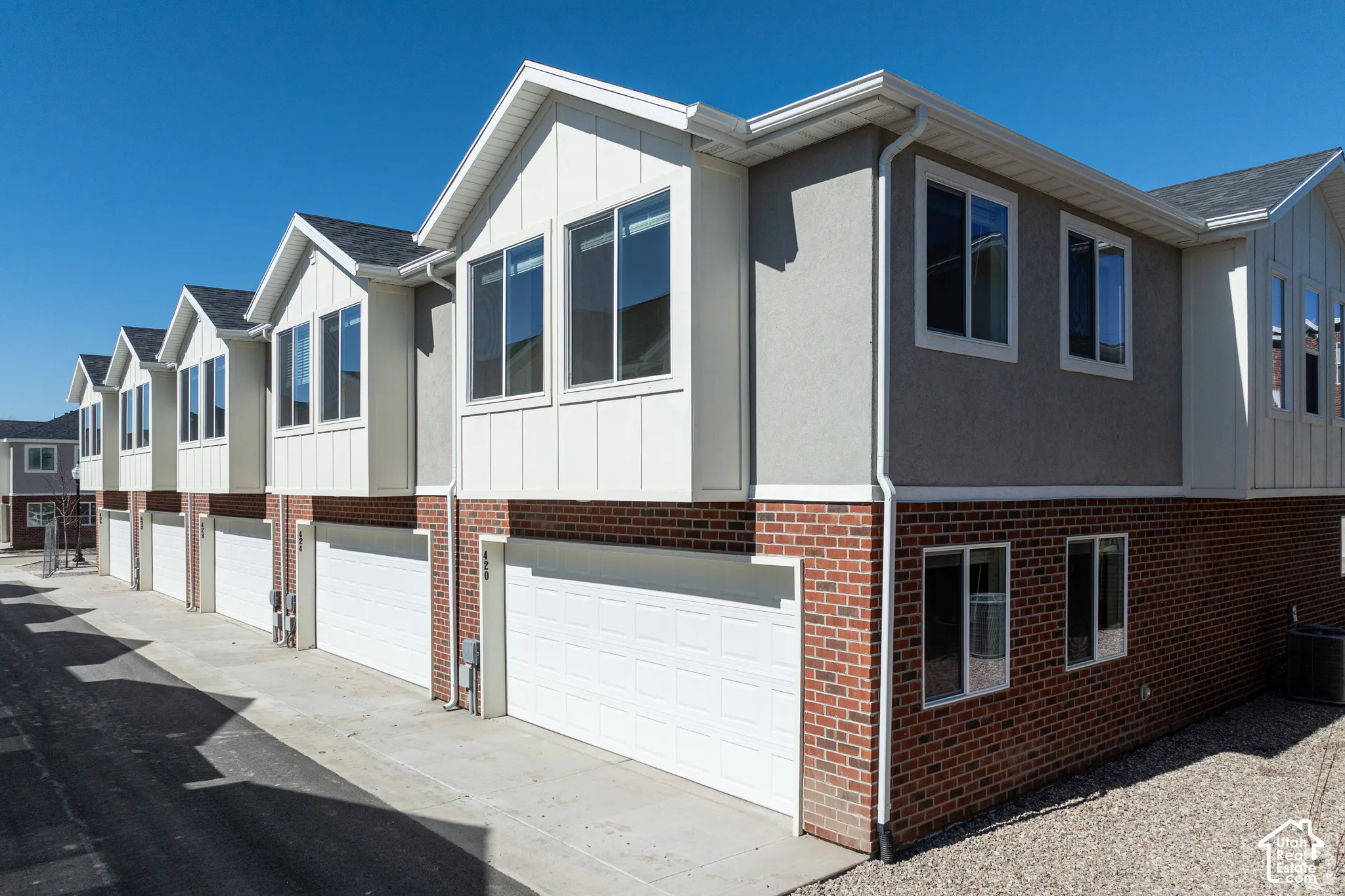 Red brick and stucco exterior with white trim