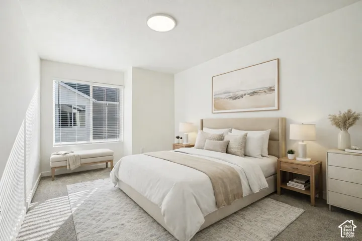 Recessed lighting, large window with blinds, neutral wall paint, and carpeted flooring