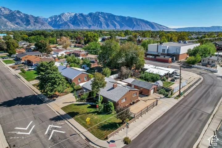 Mountain backdrop, established neighborhood setting, mature trees, brick exterior, corner property