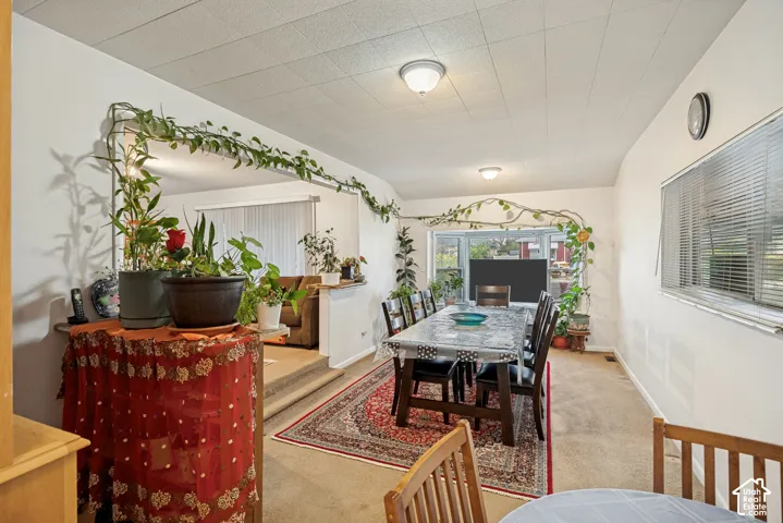 Dining area with recessed lighting and a window