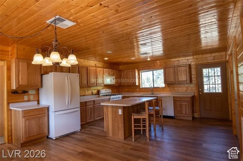 Wood-finish flooring with full wood-paneled walls and ceiling