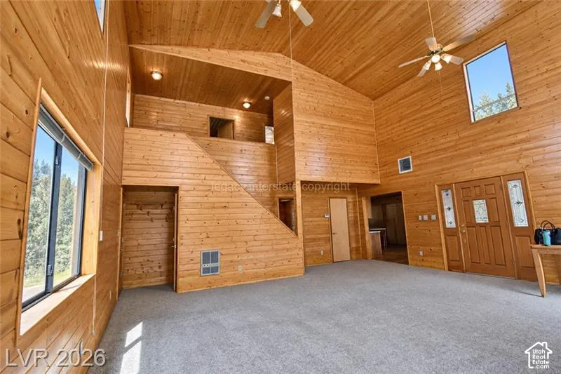 Wood-paneled walls and ceiling with a vaulted design