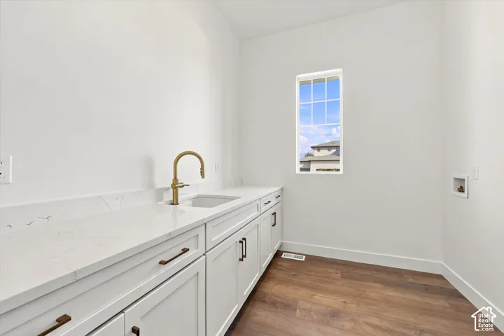 White shaker cabinetry with dark hardware
