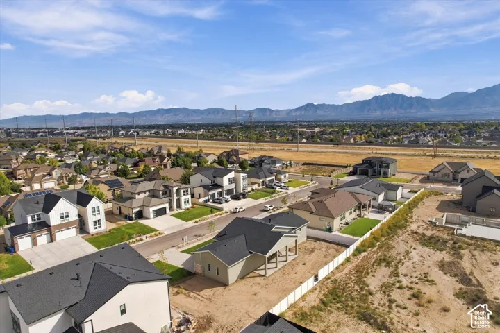 Neighborhood setting with distant mountain range backdrop