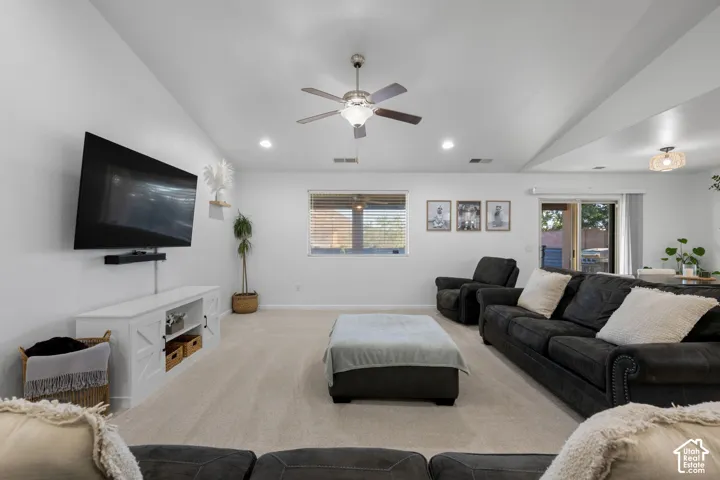 Recessed lighting, ceiling fan, white walls, and carpet flooring