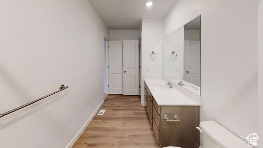 Dual vanity with integrated sinks and a white countertop
