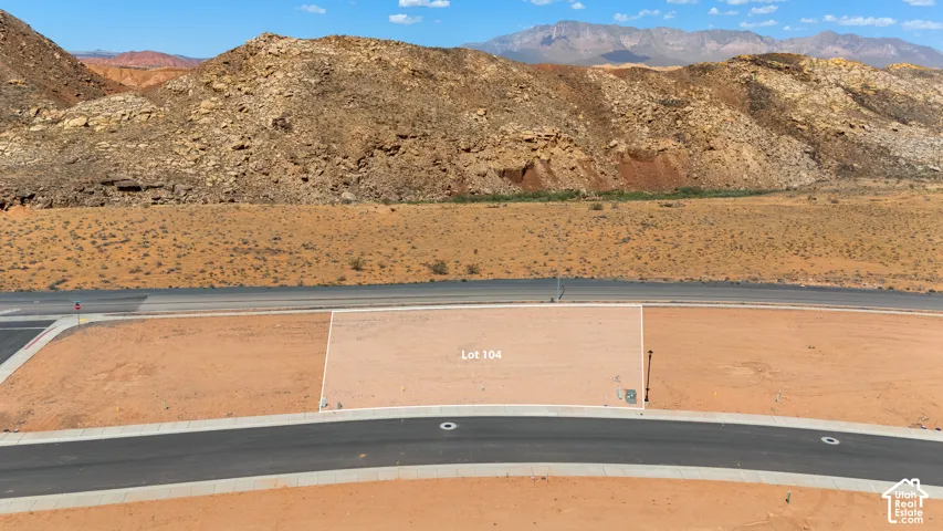 Level lot with paved road frontage, defined lot boundaries, and utilities present