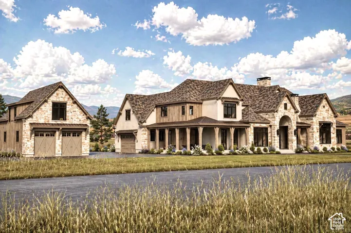 Expansive residence featuring a stone and siding exterior, multiple gables, a covered front porch, and a detached two-car garage