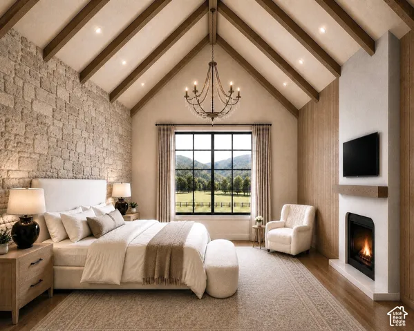 Vaulted ceiling with exposed wood beams and recessed lighting, a stone accent wall, large picture window with grid detailing, and a modern fireplace with a wood mantel