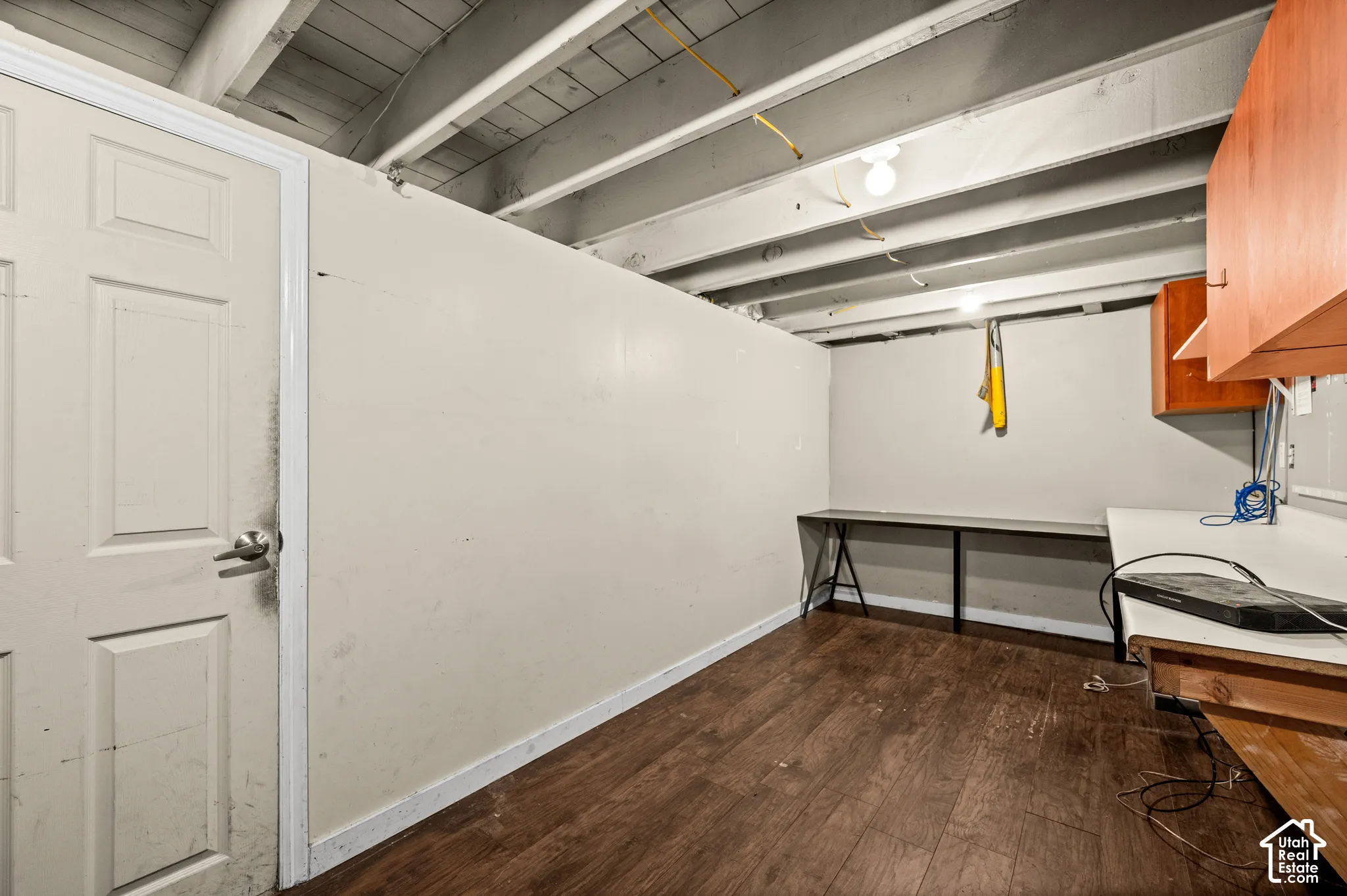 Wood-finish flooring with exposed ceiling joists