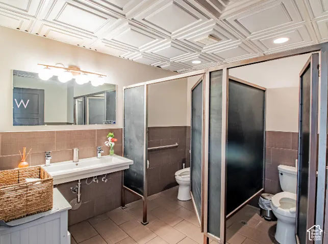 Recessed lighting illuminates a decorative ceiling