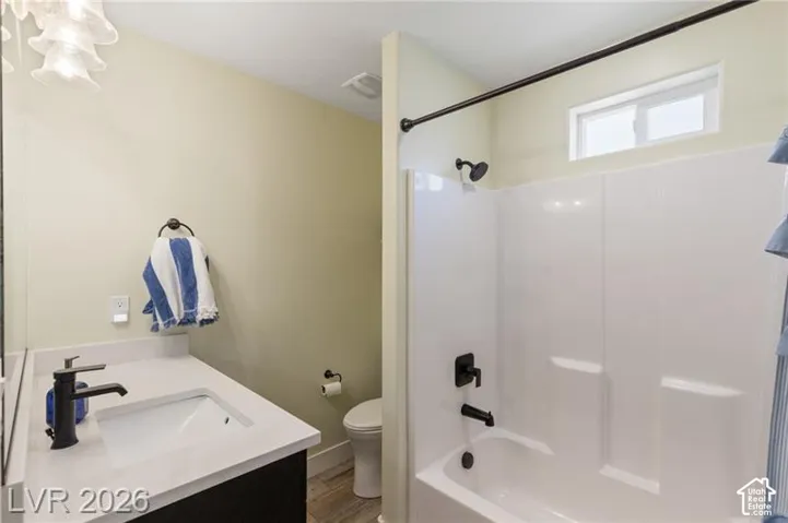 Integrated tub and shower combination with matte black fixtures