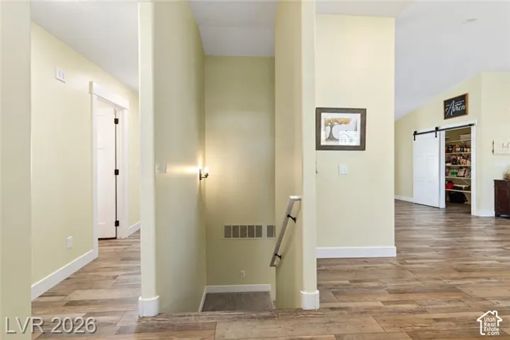 Wood-finish flooring throughout, bright interior paint, and white trim