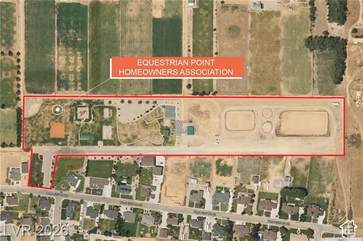 Aerial View. Identifying the boundaries and features of the property, including an associated homeowners association
