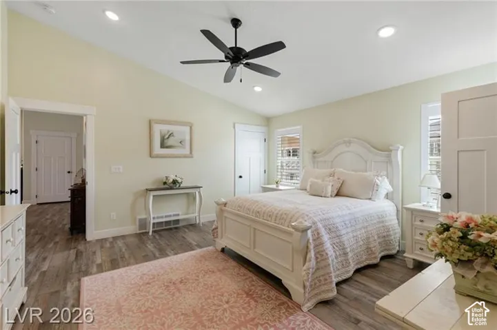Vaulted ceiling with recessed lighting and a ceiling fan