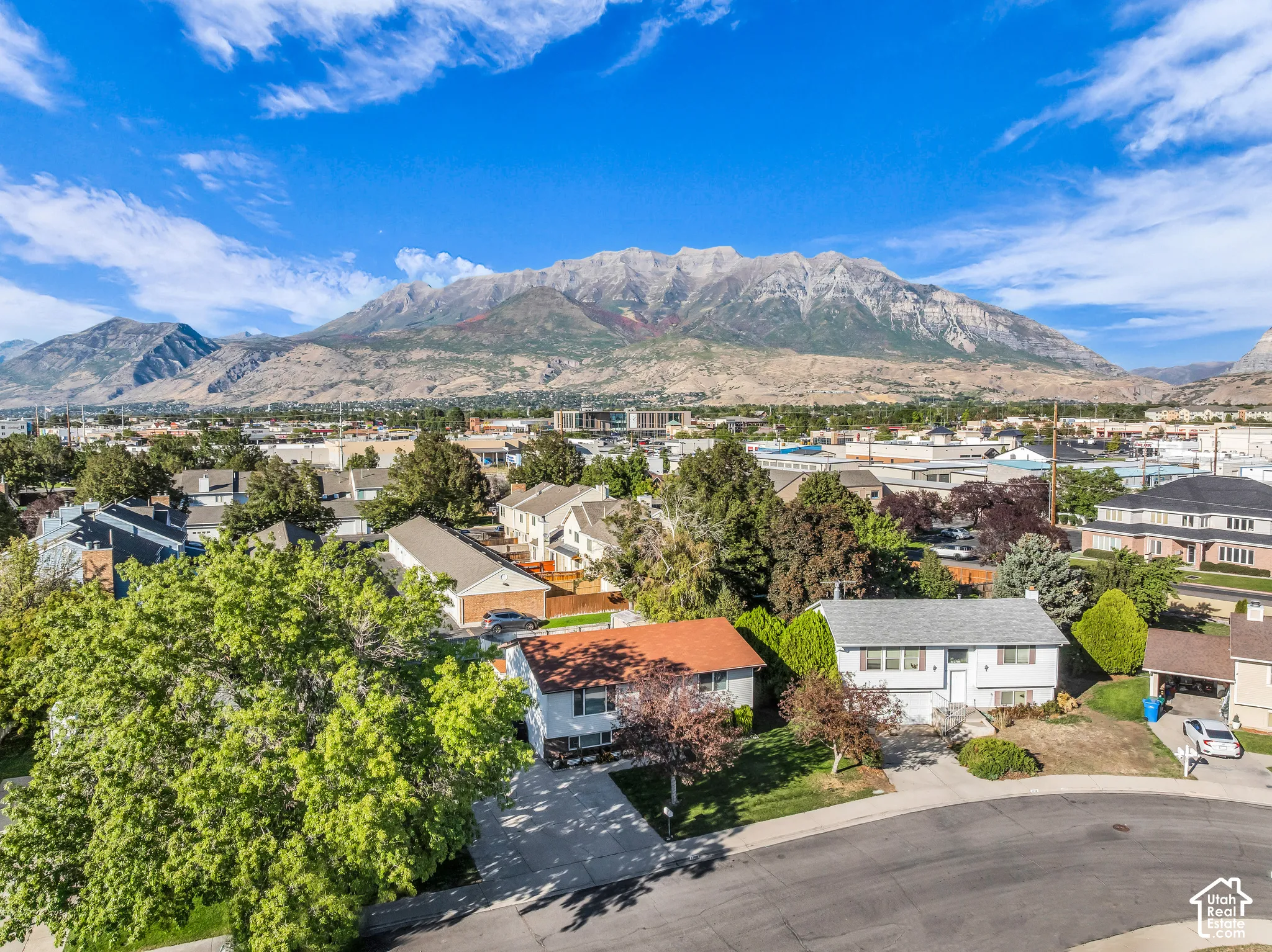 Expansive mountain backdrop with a residential neighborhood