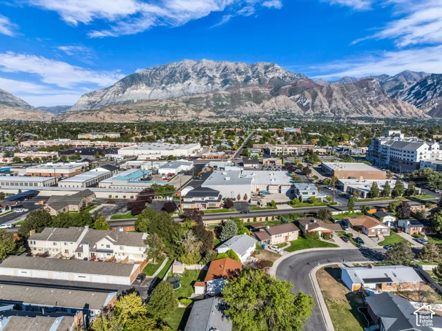 Mountain backdrop with residential and commercial areas in the foreground